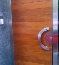 Contemporary door with horizontal panels and curved handle