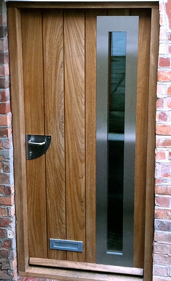 Contemporary front door with vertical boards and glazing