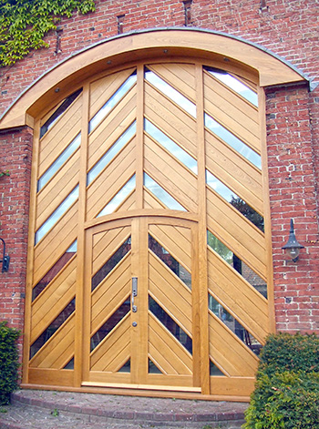 Barn door with curved hood