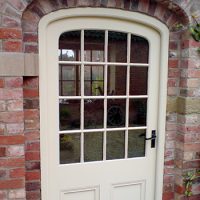 Glazed Barn Doors featuring Georgian panels and an arch