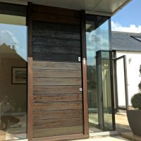 bespoke contemporary front door with horizontal boards in Ikoro